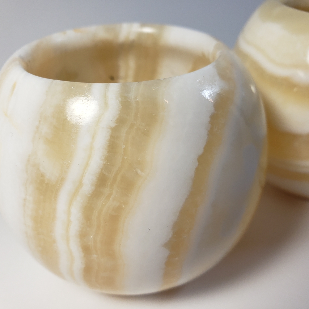 Two White and Tan Marble Candle Holders